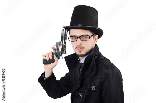 Young detective in black coat holding handgun isolated on white
