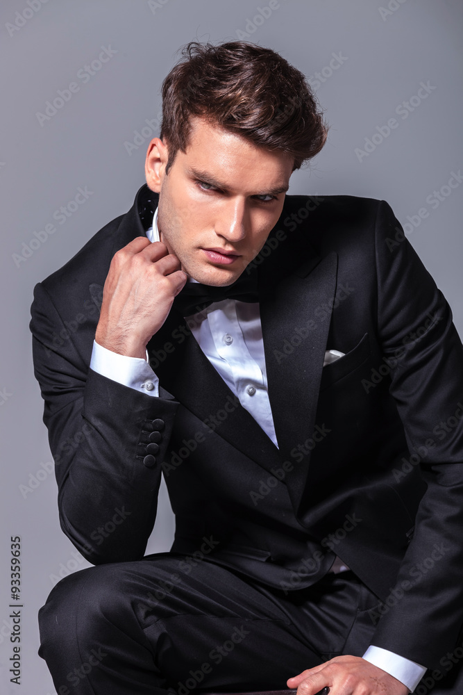 Elegant young business man looking down Elegant young business man looking down