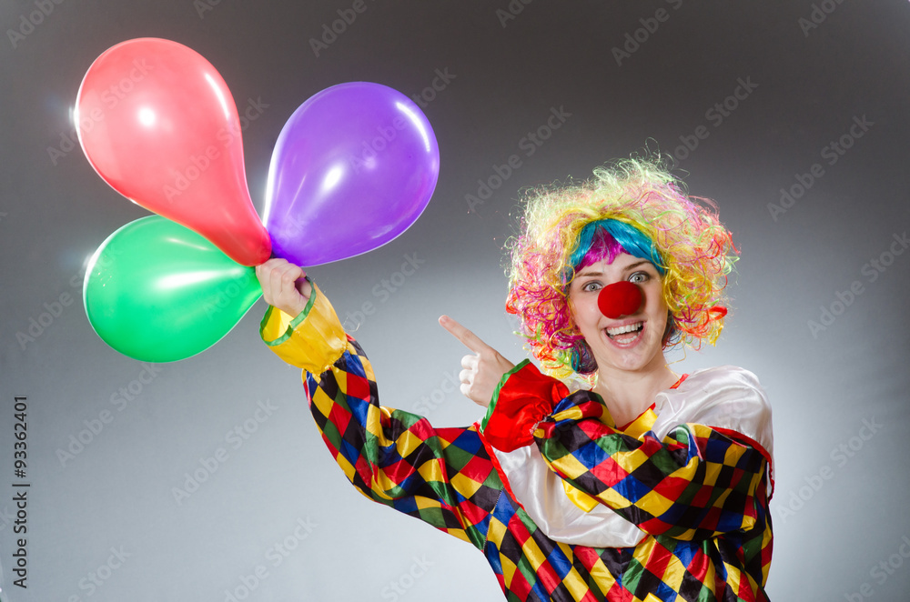 Clown with balloons in funny concept Clown with balloons in funny concept