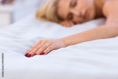 Young woman sleeping on the bed