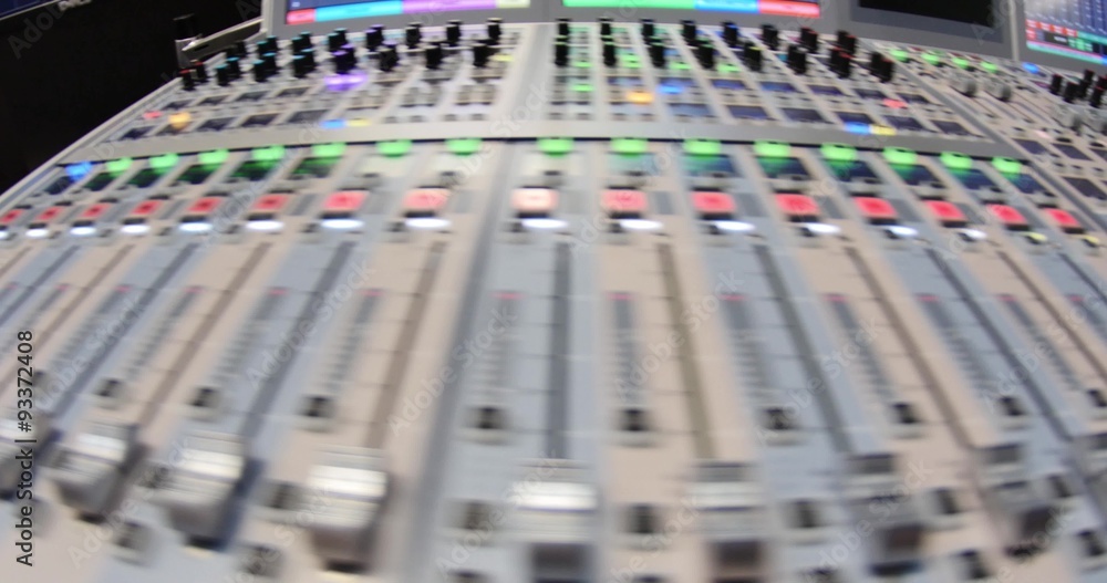A wide angle shot showing a big audio mixer, the shot is moving from the right to the left... A wide angle shot showing a big audio mixer, the shot is moving from the right to the left...