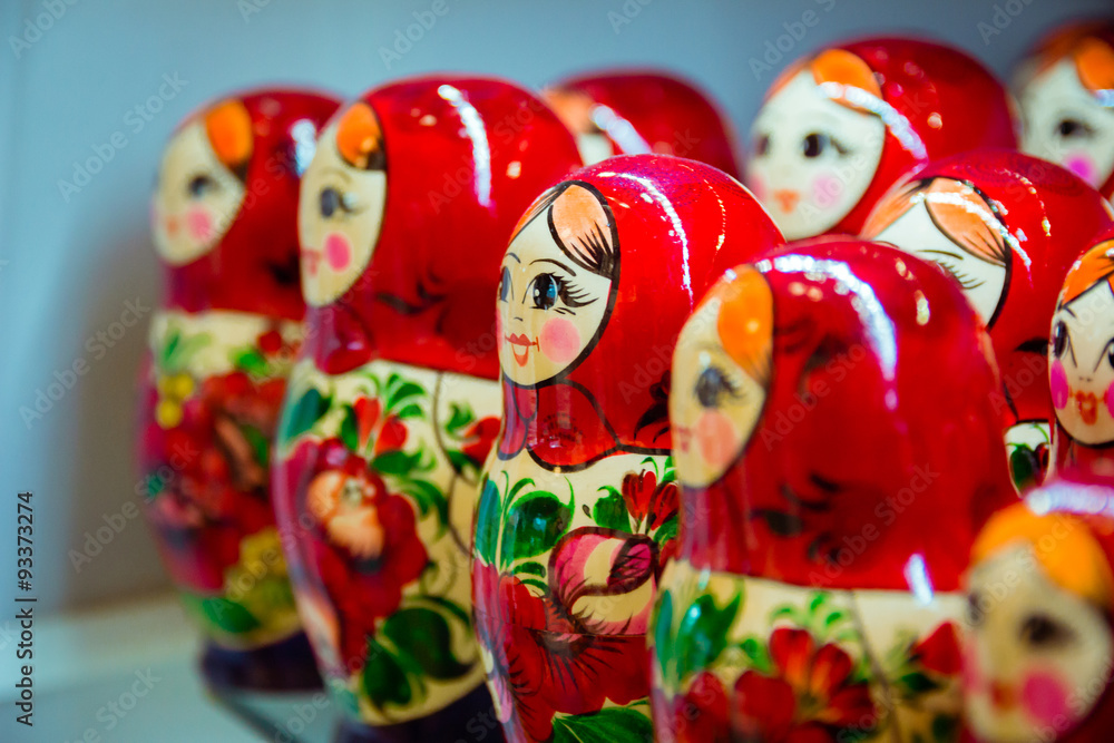 Fototapeta premium Many red babushkas arranged in a row. 