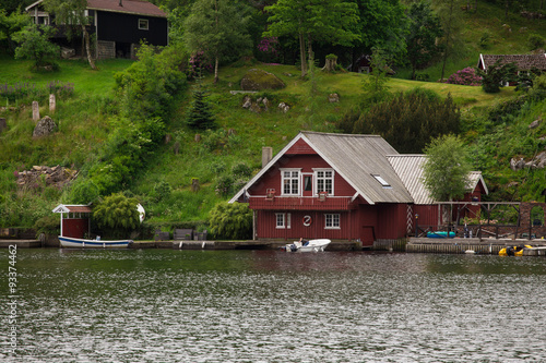 red houses on a lake coast #93374462