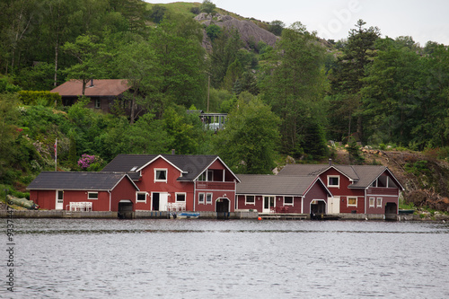 red houses on a lake coast #93374476