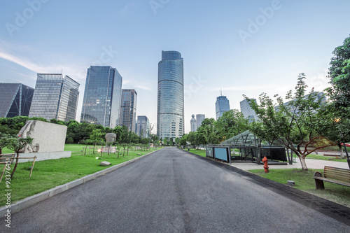 asphalt road of a modern city with skyscrapers