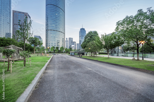 asphalt road of a modern city with skyscrapers