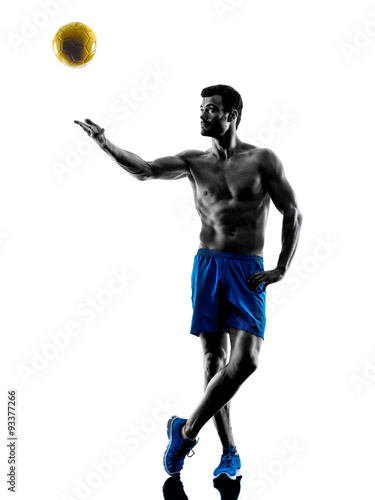 Fototapeta man playing beach volley silhouette
