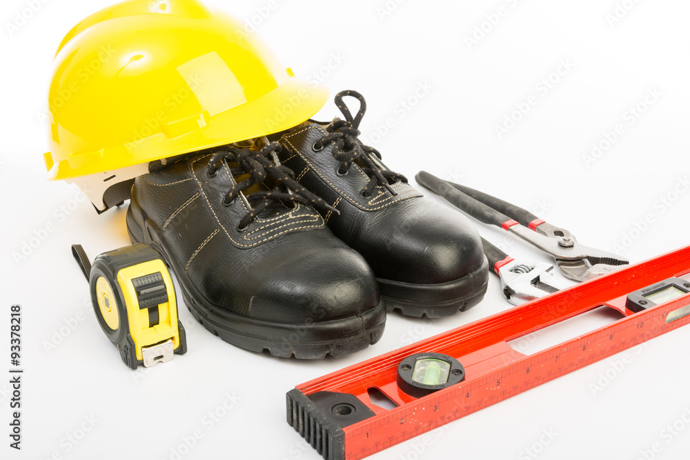 Fototapeta premium Yellow hard hat and tools