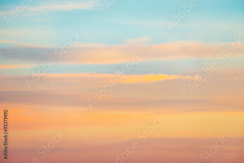 Pale sunset sky with pink, orange and red colors