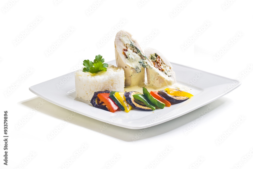 Turkey rolls with gorgonzola cheese, dried tomatoes and spinach stuffing with grilled vegetables and rice