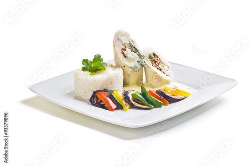 Obraz na płótnie Turkey rolls with gorgonzola cheese, dried tomatoes and spinach stuffing with grilled vegetables and rice w salonie