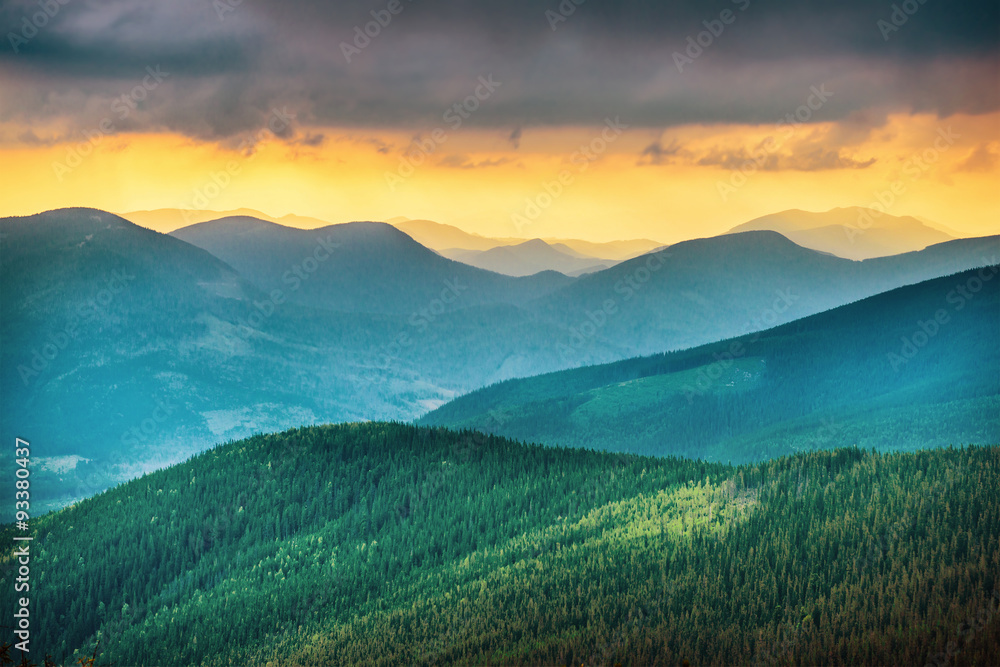 Fototapeta premium Sunset over blue mountains