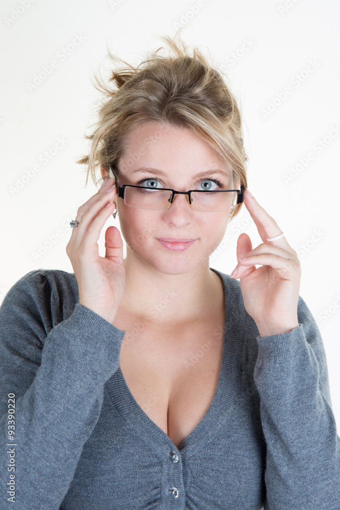 Young blond woman with glasses and grey top Young blond woman with glasses and grey top