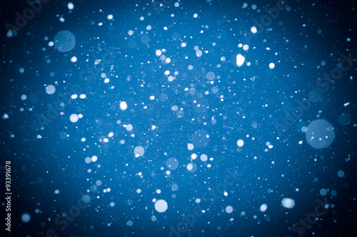 Winter background. falling snow on blue background