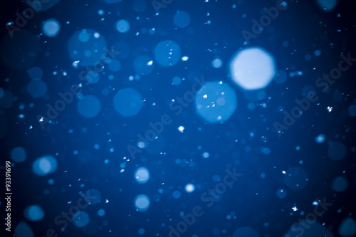 Winter background. falling snow on blue background