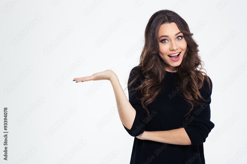 Cheerful girl holding copyspace on the palm Cheerful girl holding copyspace on the palm