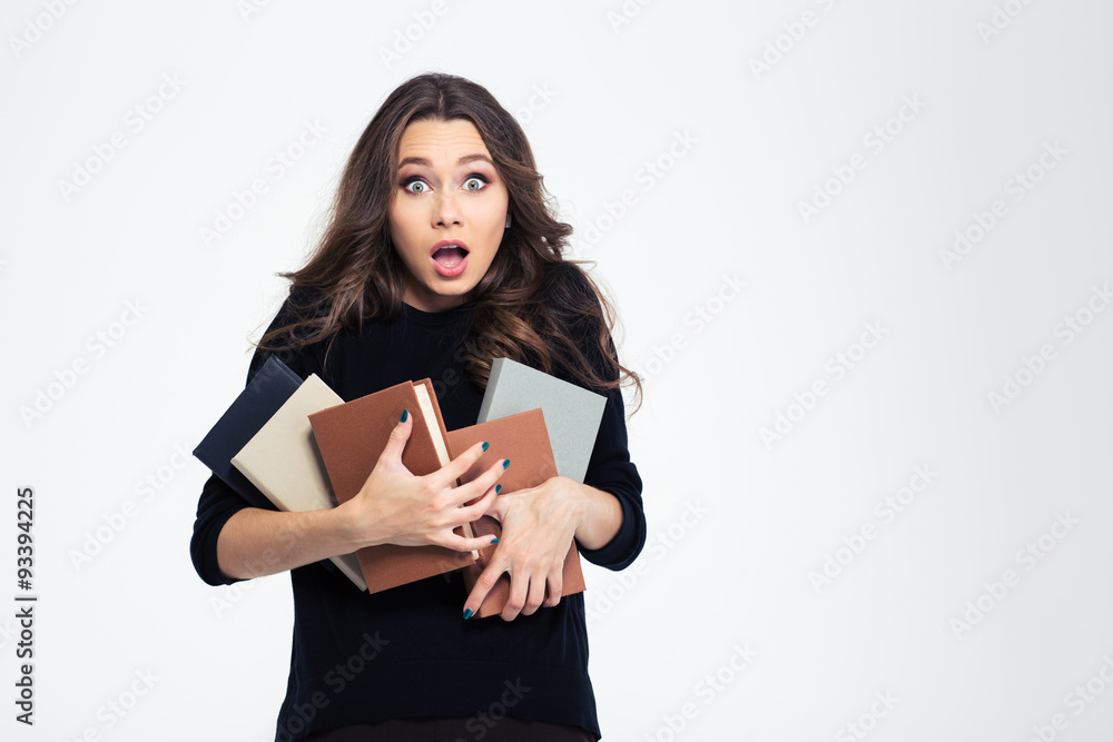 Portrait of amazed female student holding books Portrait of amazed female student holding books