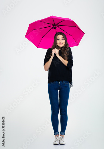 Smiling woman standing under umbrella © Drobot Dean