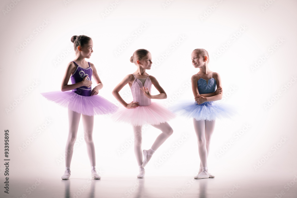 Three little ballerinas in dance studio