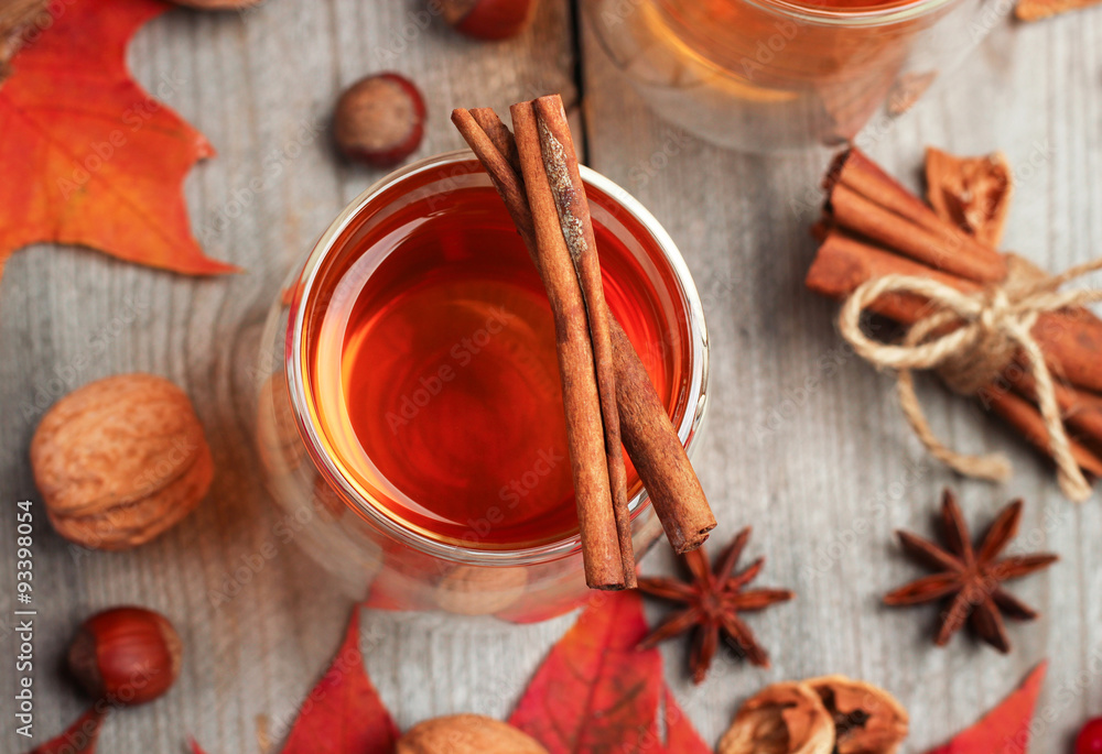 Autumn hot beverage in a glass with fruits and spices Autumn hot beverage in a glass with fruits and spices