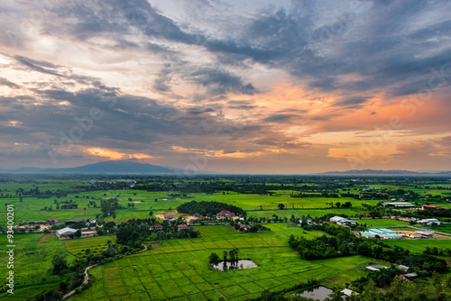 High angle view of fields and villages at sunset.