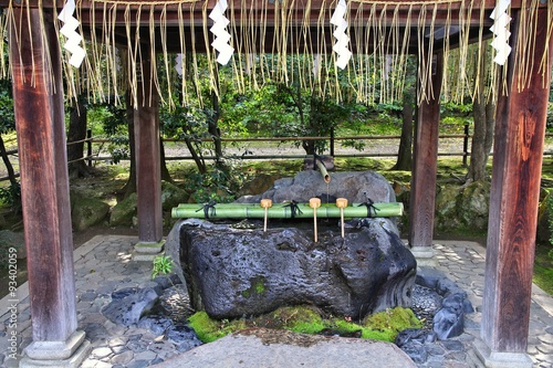 Purification fountain - Buddhist custom in Japan photo