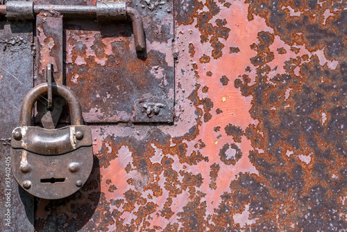 surface of rusty iron with remnants of old paint texture background © uvisni