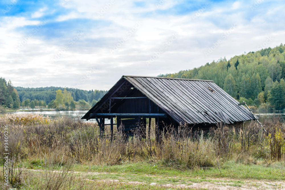 Autumn landscape. Old abandoned village on the empty field. Dete Autumn landscape. Old abandoned village on the empty field. Dete