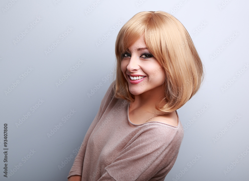 Happy toothy smiling young woman with short blond hair Happy toothy smiling young woman with short blond hair