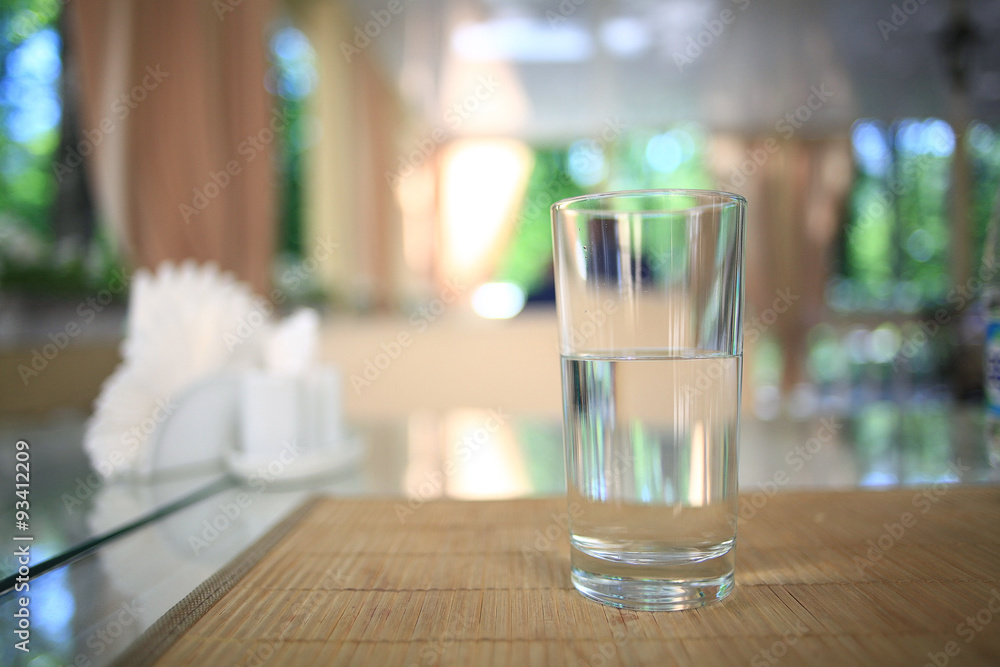 glass of water on a table in a restaurant glass of water on a table in a restaurant