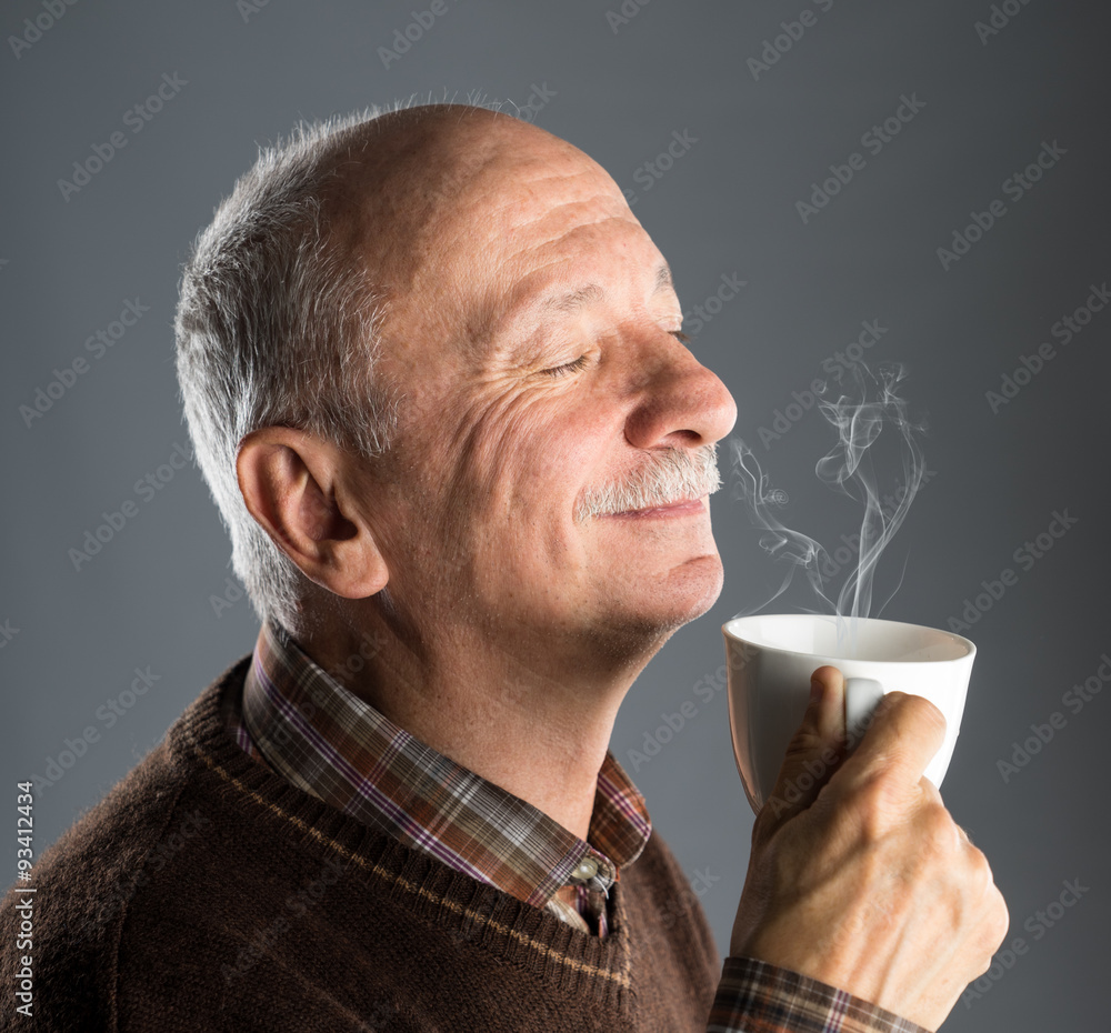 Senior man drinking cup of coffee Senior man drinking cup of coffee