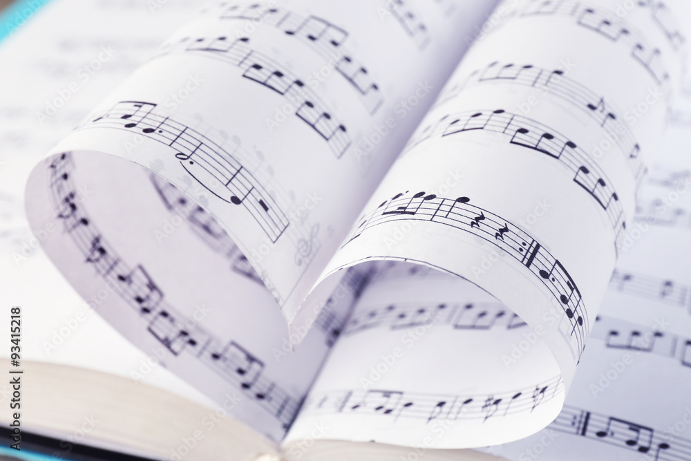 Naklejka premium Book pages curved into heart shape close up