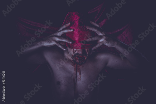 Nightmare, naked man on large red cloth over his eyes