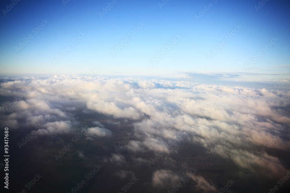 view from the bird's-eye view of the airplane window at the horizon and clouds view from the bird's-eye view of the airplane window at the horizon and clouds