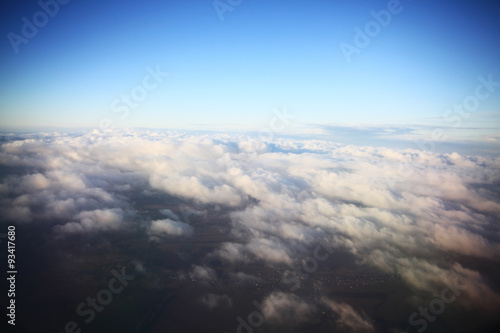 view from the bird s-eye view of the airplane window at the horizon and clouds