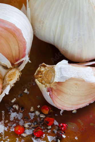 Garlic cloves close up. Top view. Copper background. photo