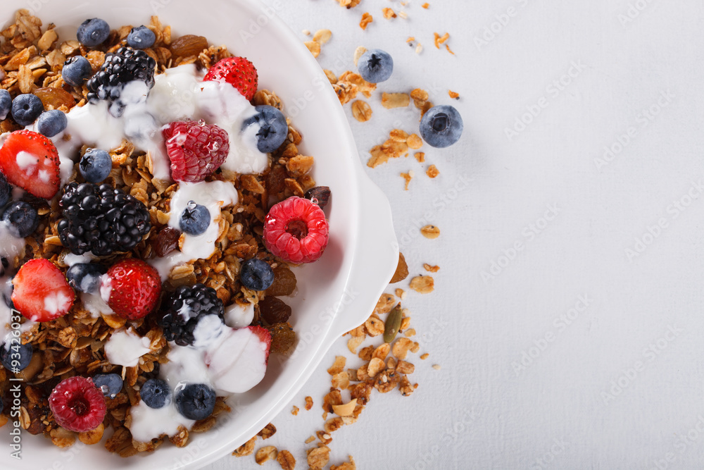 Homemade granola with fresh berries and honey. Homemade granola with fresh berries and honey.