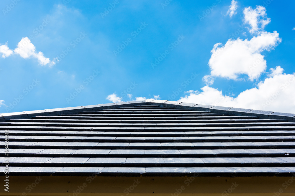 roof tiles with blue sky background - obrazy, fototapety, plakaty 