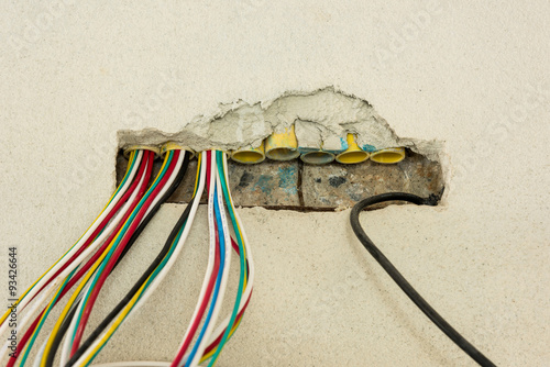 Wire box with different colored cables for power outlet installa photo