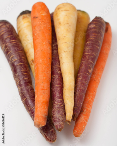 different colored fresh picked assorted carrots and parsnips