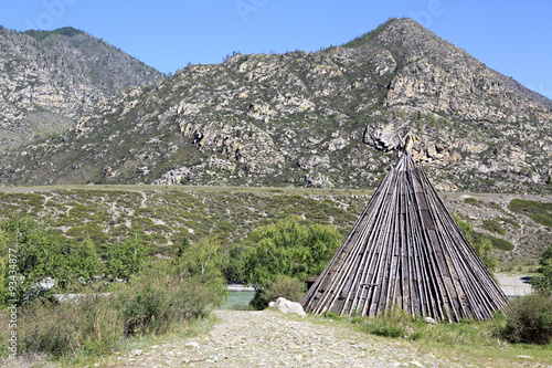 Wooden hut at the confluence of mountain rivers Big Ilgumen and photo