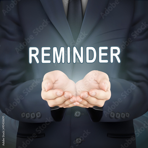 businessman holding reminder word