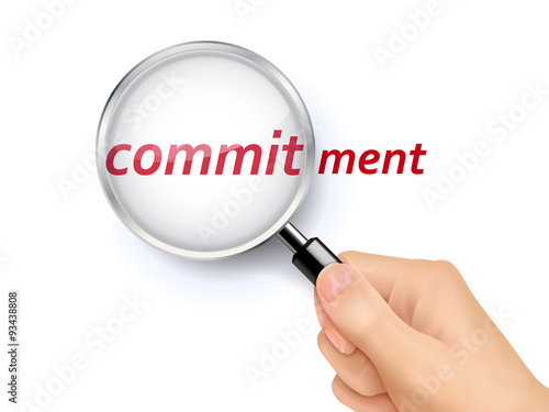 commitment word showing through magnifying glass
