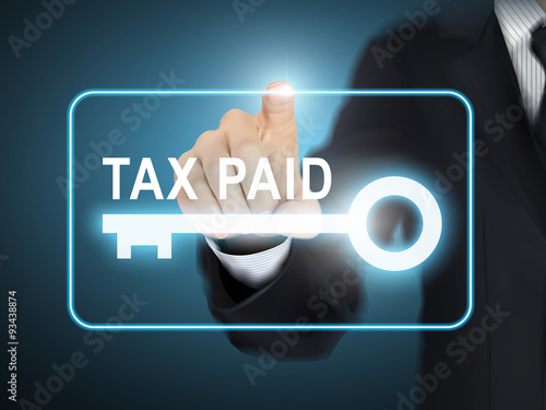 male hand pressing tax paid key button