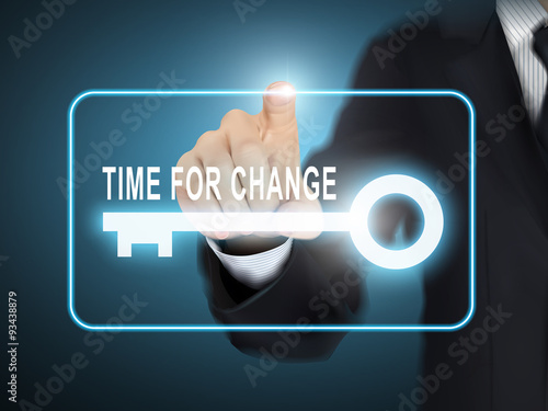 male hand pressing time for change key button