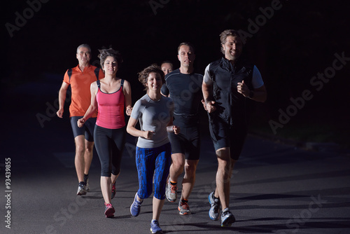 people group jogging at night