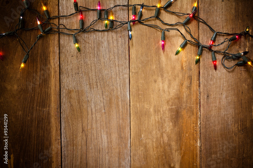 Top view, Christmas and New Year lights on old wood background
