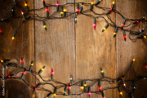 Top view, Christmas and New Year lights on old wood background