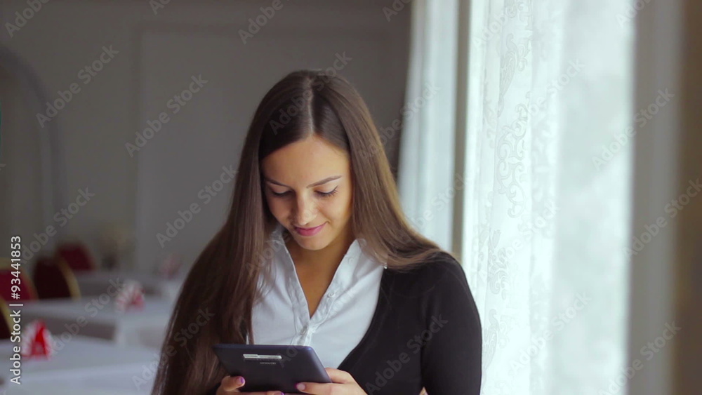 Young beautiful girl businessman running distant work on the Young beautiful girl businessman running distant work on the