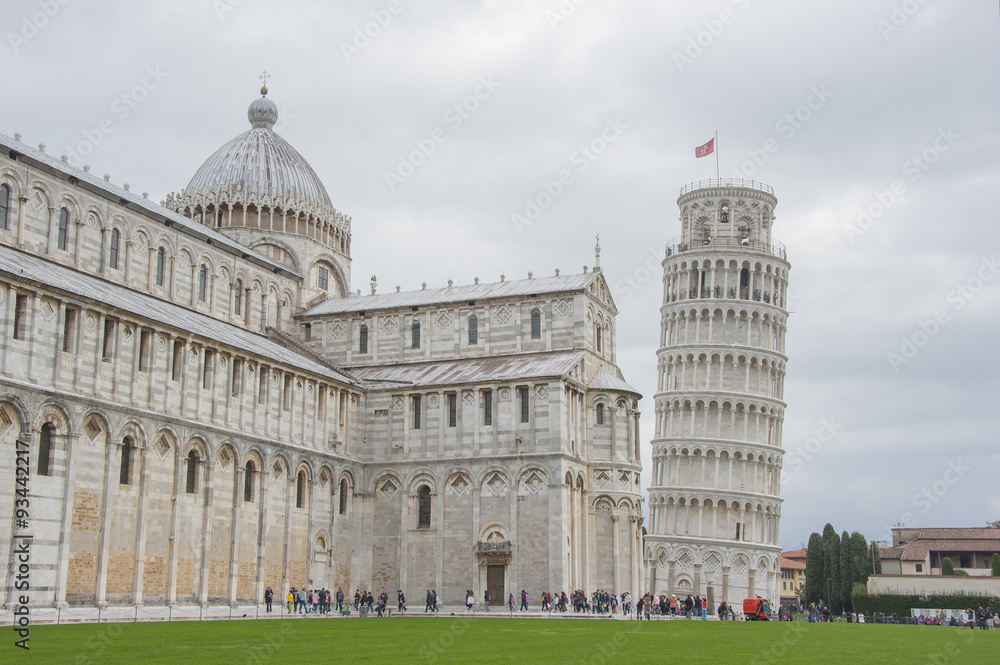 Tourist visiting the leaning tower of Pisa , Italy.